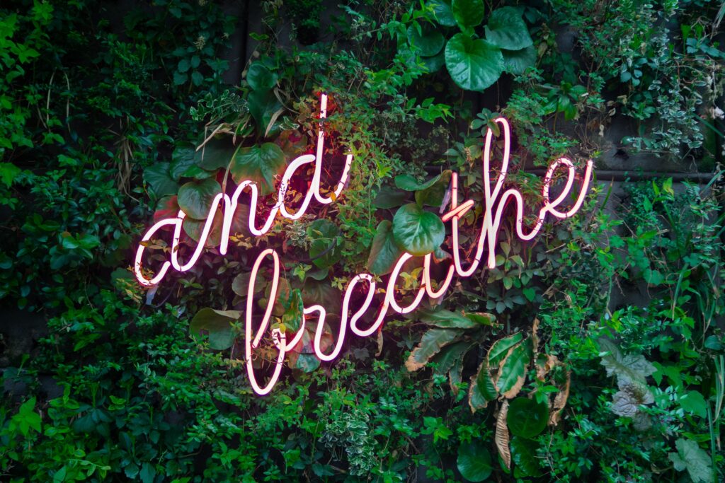 and breath on neon light with green background