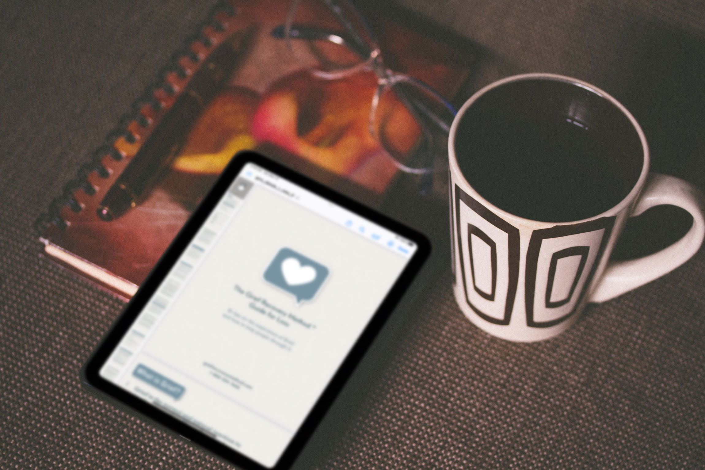ebook reader and coffee on table